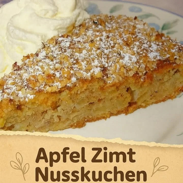 Slice of Apfel-Zimt-Nusskuchen with apples and nuts on a plate