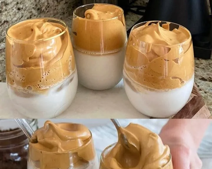 Erfrischender Eiskaffee mit Sahne und Eiswürfeln