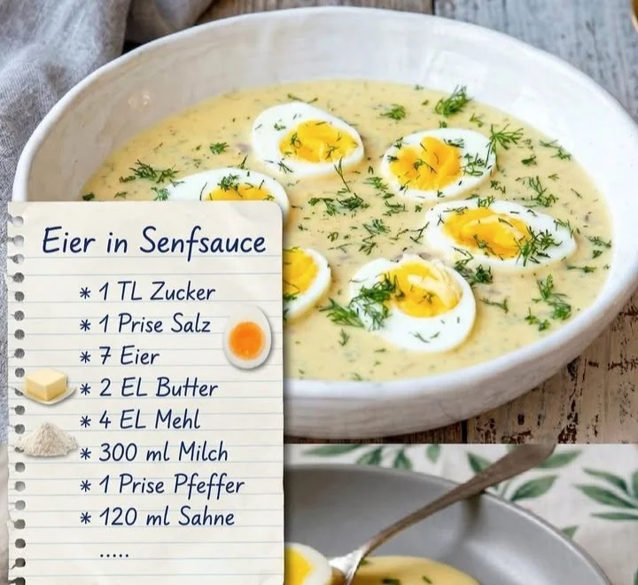 Eier in Senfsauce serviert auf einem Teller mit frischen Kräutern.