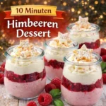 Himmlisches Dessert mit Himbeeren auf einem weißen Teller, verziert mit Minze.