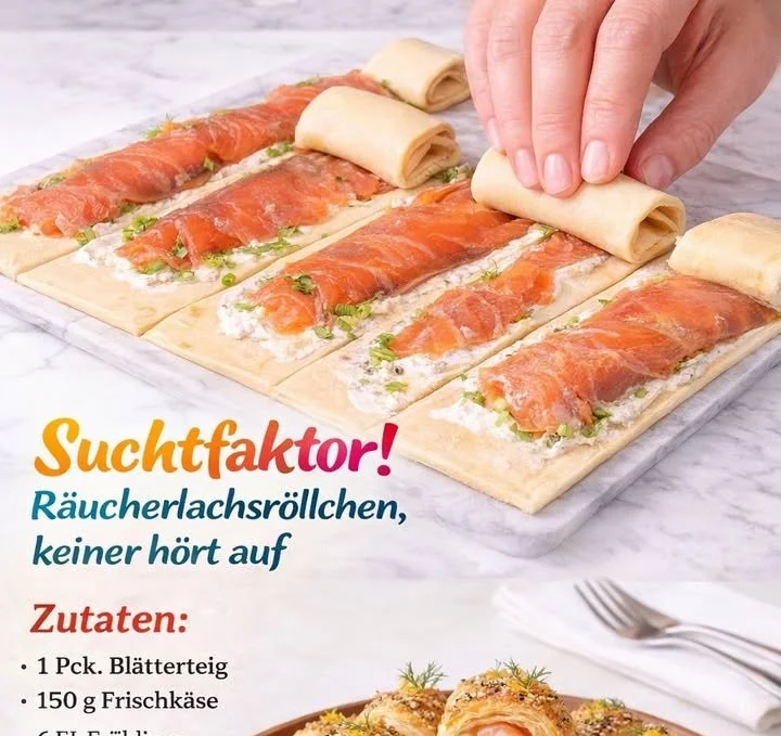 Räucherlachsröllchen serviert auf einem Platz mit frischen Kräutern.