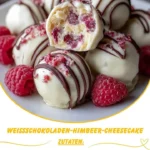 Weißschokoladen-Himbeer-Cheesecake-Bällchen auf einem Teller