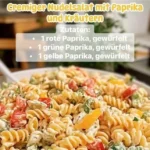 Cremiger Nudelsalat mit frischer Paprika und Kräutern zubereitet.