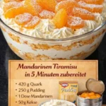Mandarinen-Tiramisu auf einem Teller mit Mandarinenstücken dekoriert
