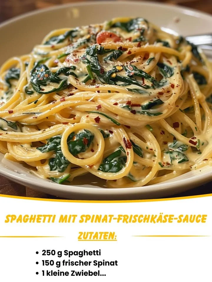 Spaghetti mit Spinat und Frischkäse-Sauce auf einem Teller serviert