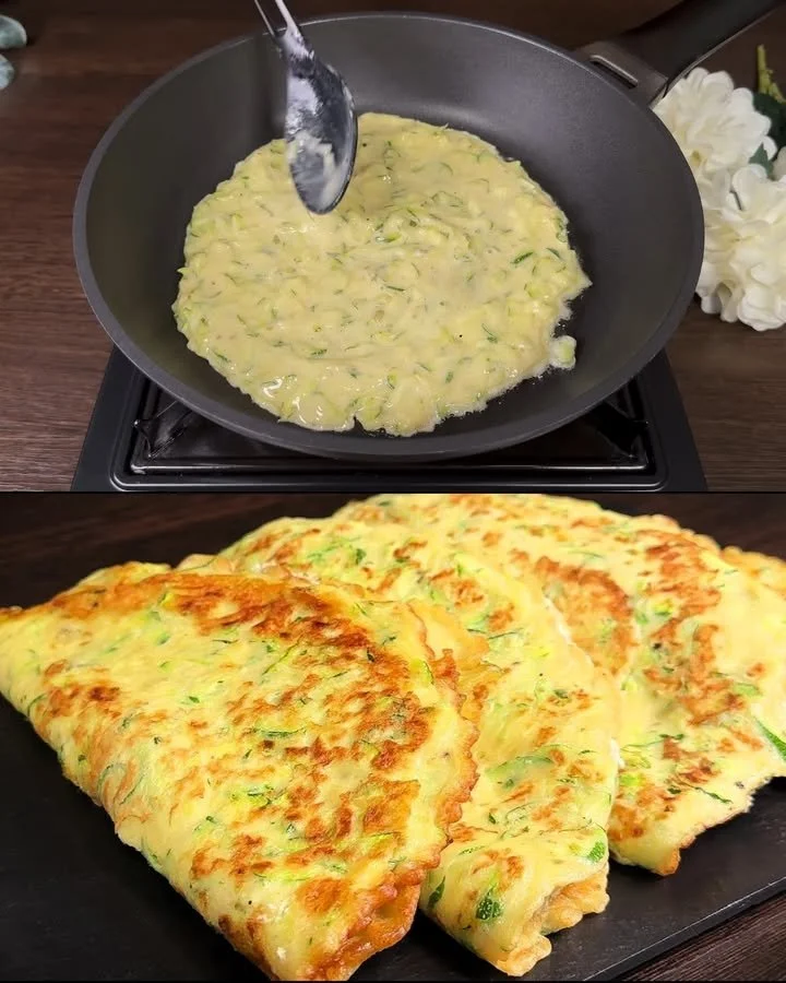 Zucchini Eier Pfannkuchen auf einem Teller, serviert mit frischen Kräutern.