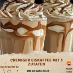 Cremiger Eiskaffee im Glas mit Sahne und Eiswürfeln