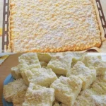 Einfacher Sahnekuchen mit Streuseln und Sahne auf einem weißen Teller